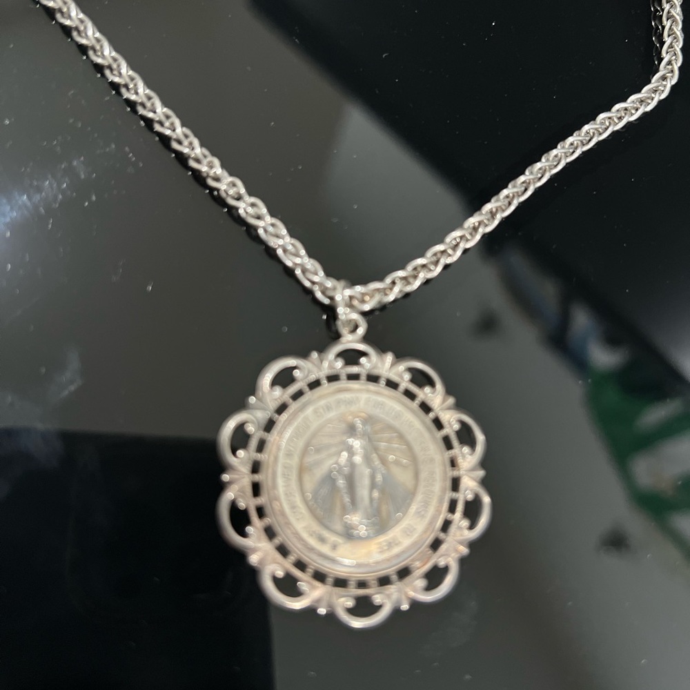 Sterling silver religious medal on a 18” chain